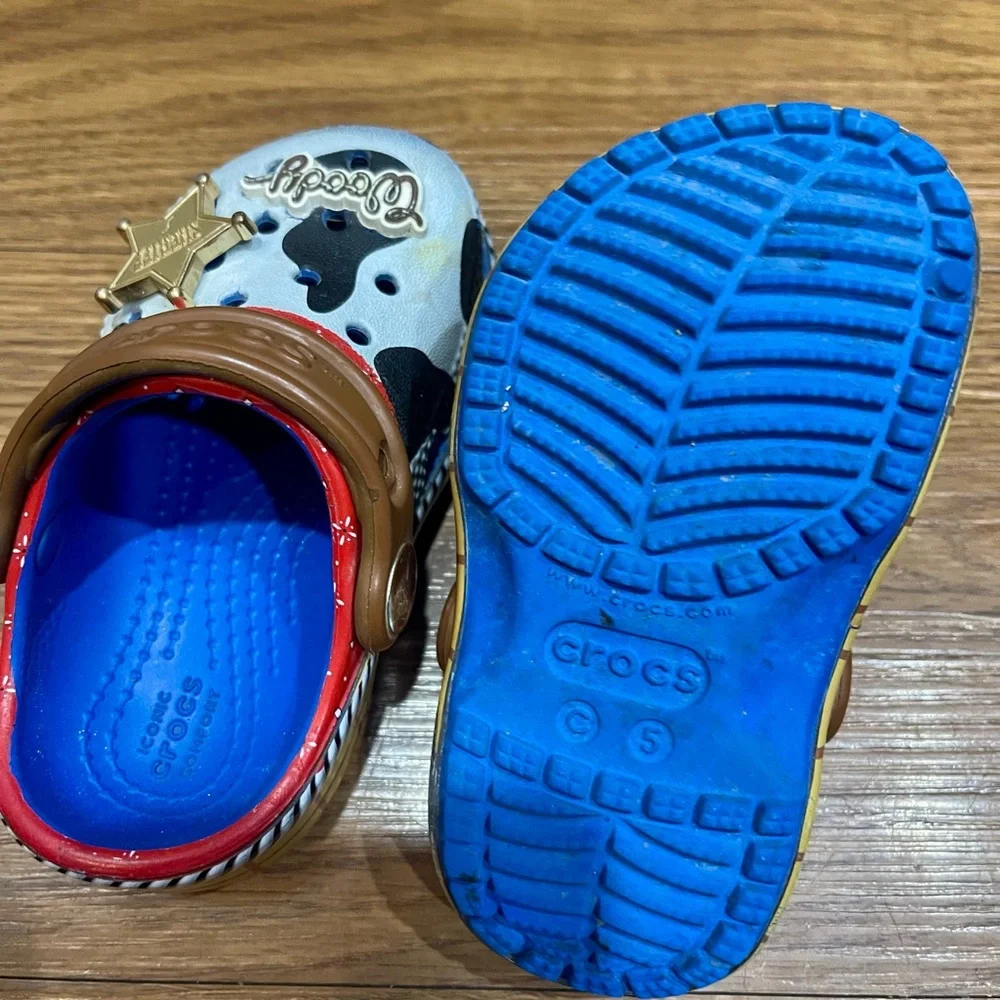 CROCS Kids Woody Cow Print Clogs in White, Black & Brown